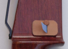 A target archery arrow rest made out of plastic from a bottle and a piece of leather
